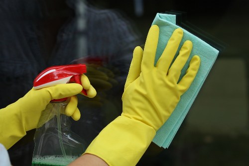 Professional home cleaners in Kennington working in a modern living room
