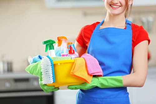 Cleaning professional in Kennington preparing a safe work area