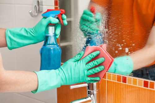 Experienced cleaners in Kennington maintaining a tidy living room