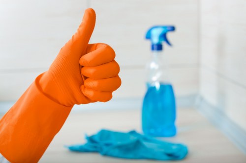 Technician using carpet cleaning equipment in Kennington