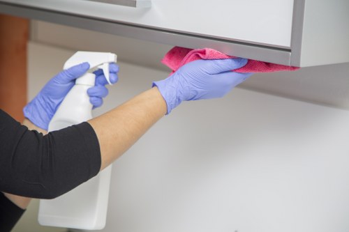 Trained cleaning staff completing a careful cleaning task